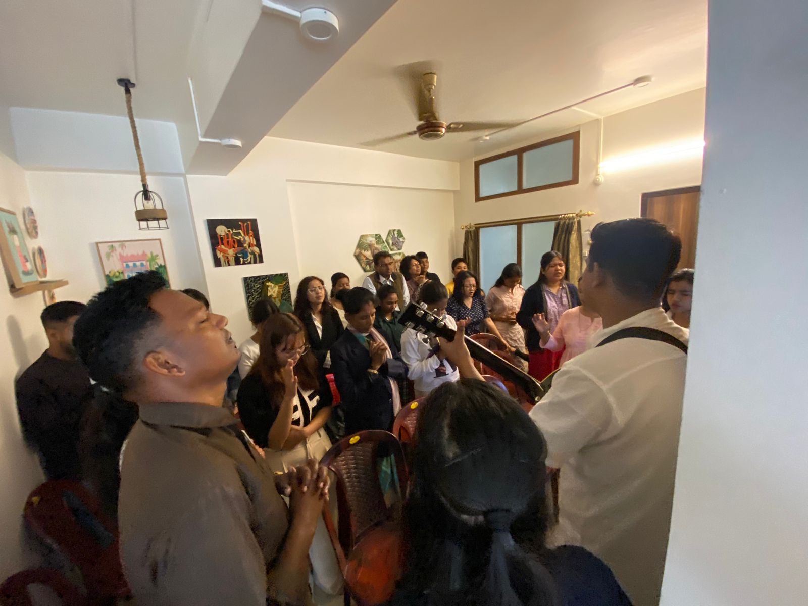 Members sharing fellowship at AAKHIKH